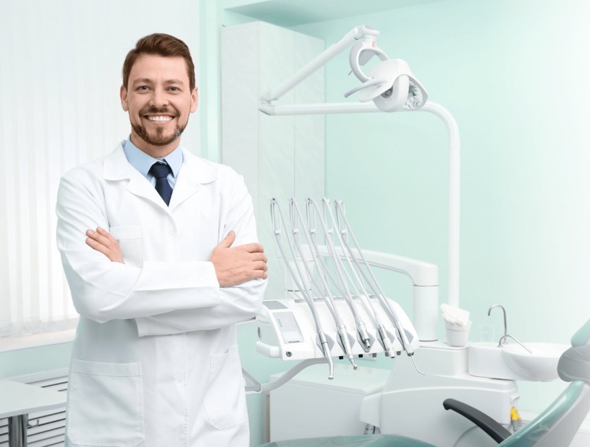 A smiling Bravo! Dental dentist in a bright, modern treatment room.